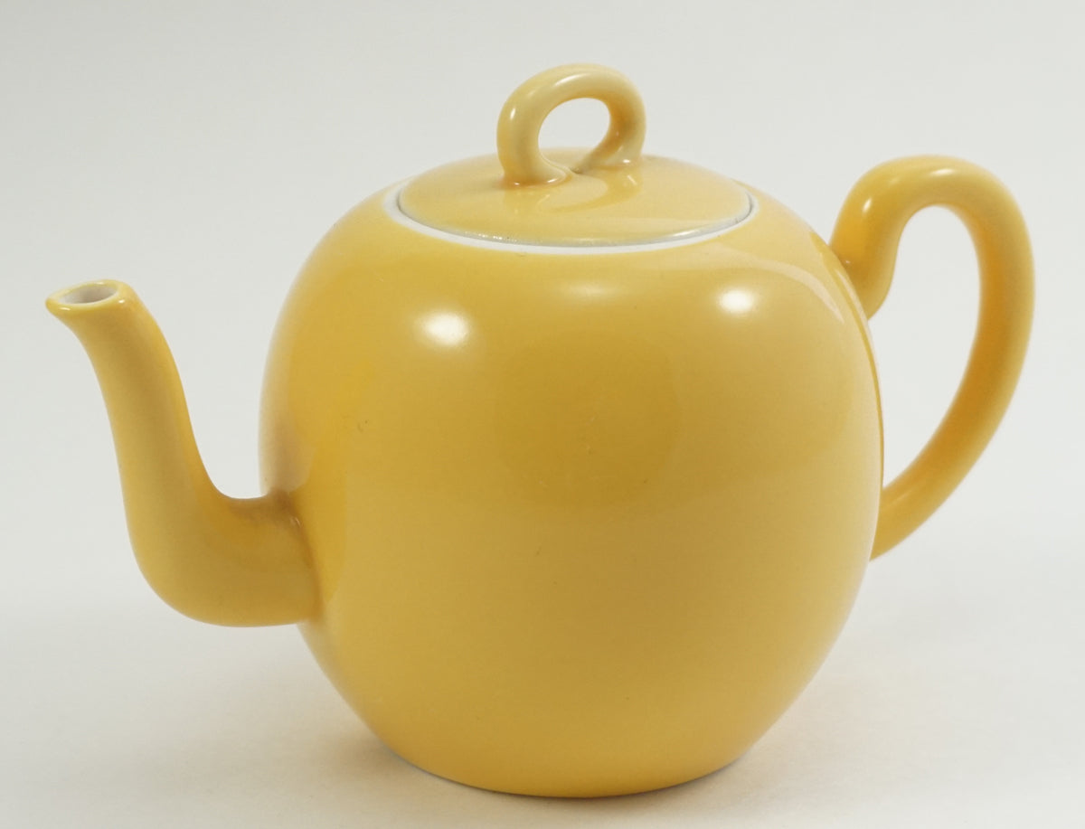 Cream yellow porcelain teapot